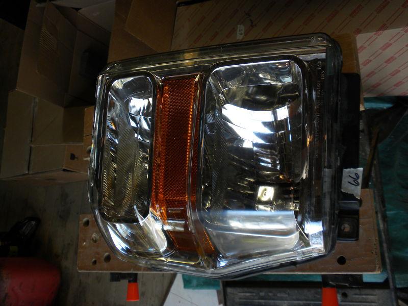 2010 ford truck headlight o.e.m.