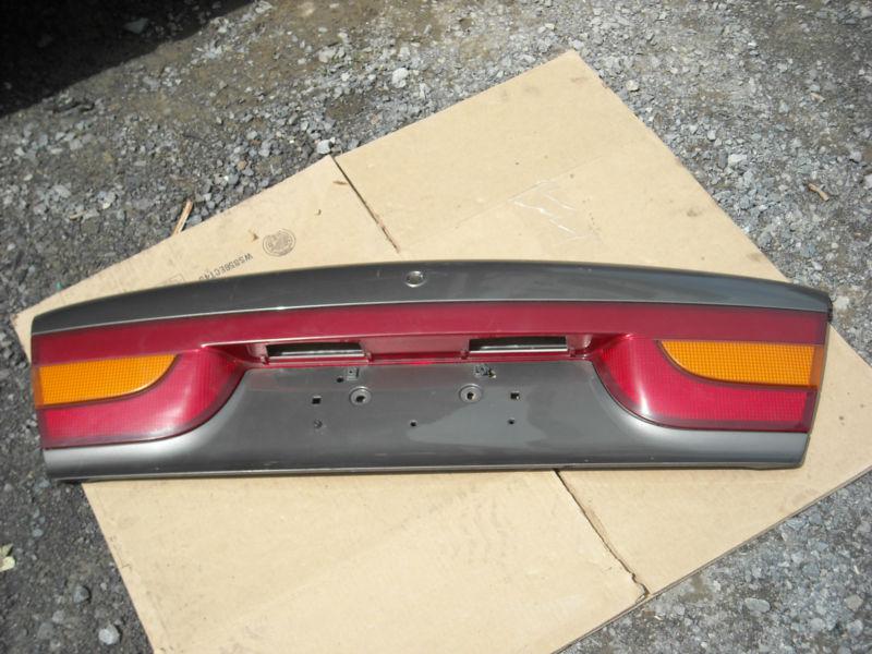 99 00 saturn s series center light lamp tail finish panel *darker color panel*