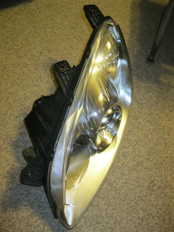 Saturn sky left headlight lamp  gm 25836066