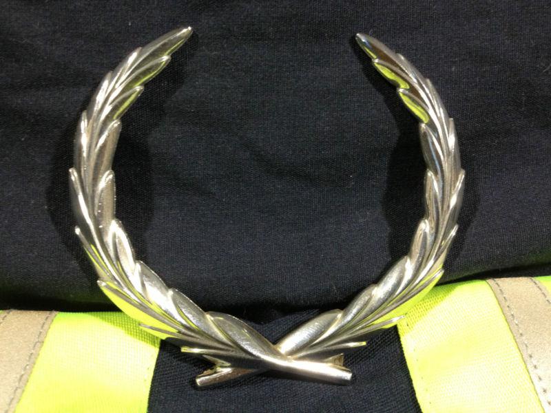 1980-1996 cadillac deville,seville,fleetwood trunk lid panel wreath emblem