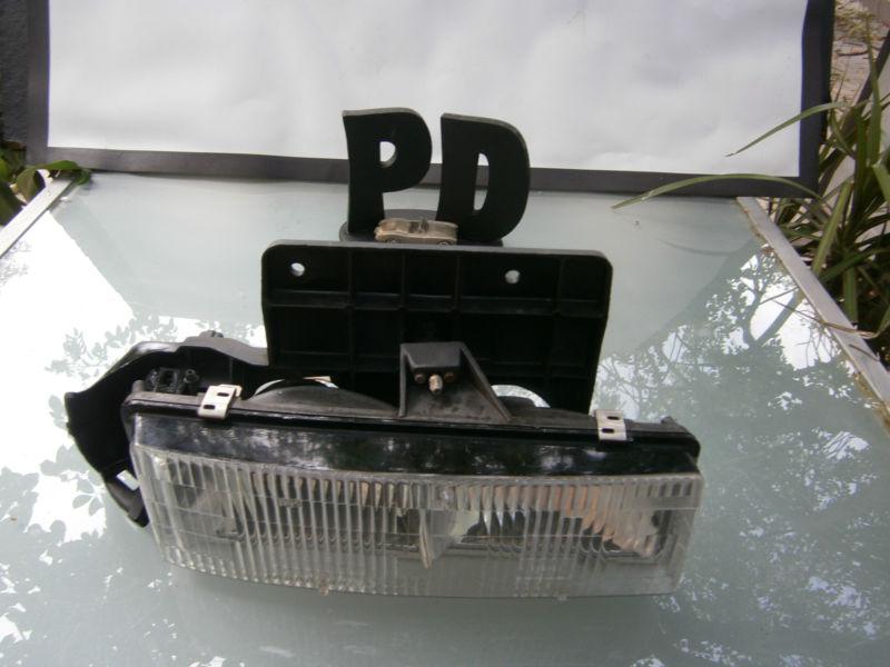 1995-2005 gmc safari r.headlight passenger assembly  p/n 16518494  oem/warranty