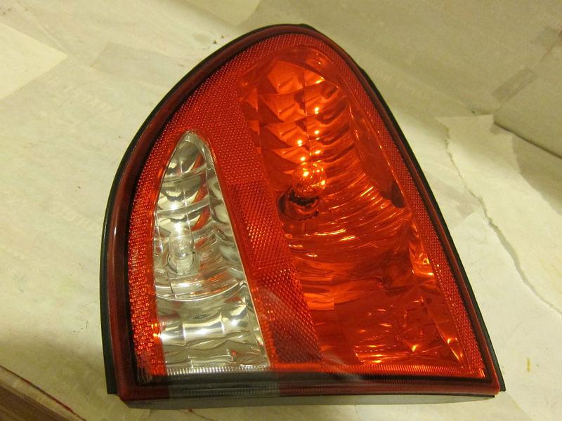 99-04 oldsmobile alero oem used rh-passenger tail light on trunk