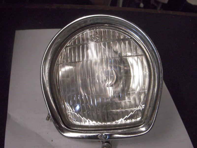 Suzuki headlight ring and 6 volt bulb in glass nos factory original