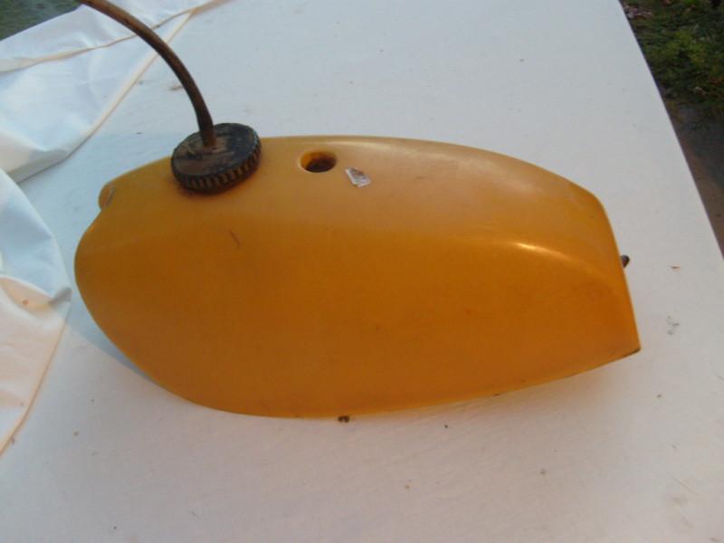 Universal yellow plastic fuel tank with cap and fuel valve