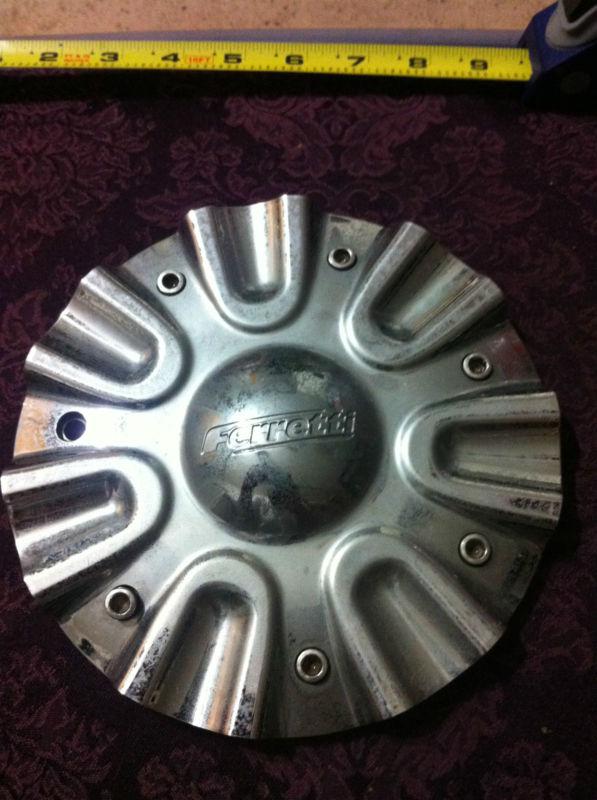 1 ferretti wheels chrome center cap   part# 2131495  stock# 239