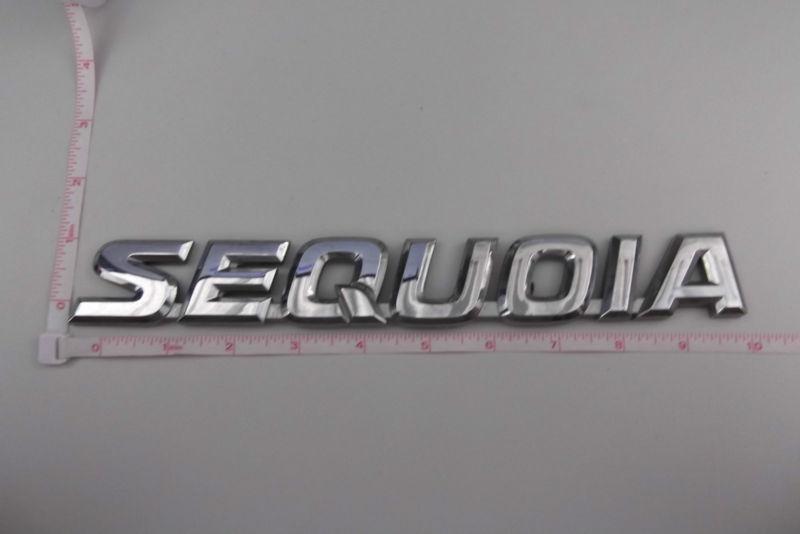 01-07 toyota sequoia rear liftgate nameplate emblem logo symbol sign trunk oem