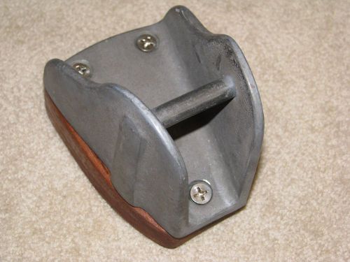 Aluminum mast chock for whisker or spinnaker pole with teak mounting base