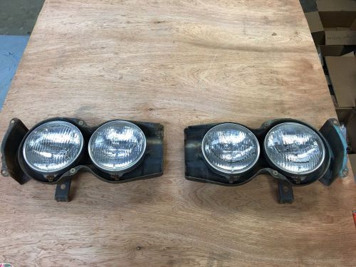 1964  chevelle head light buckets and trim rings