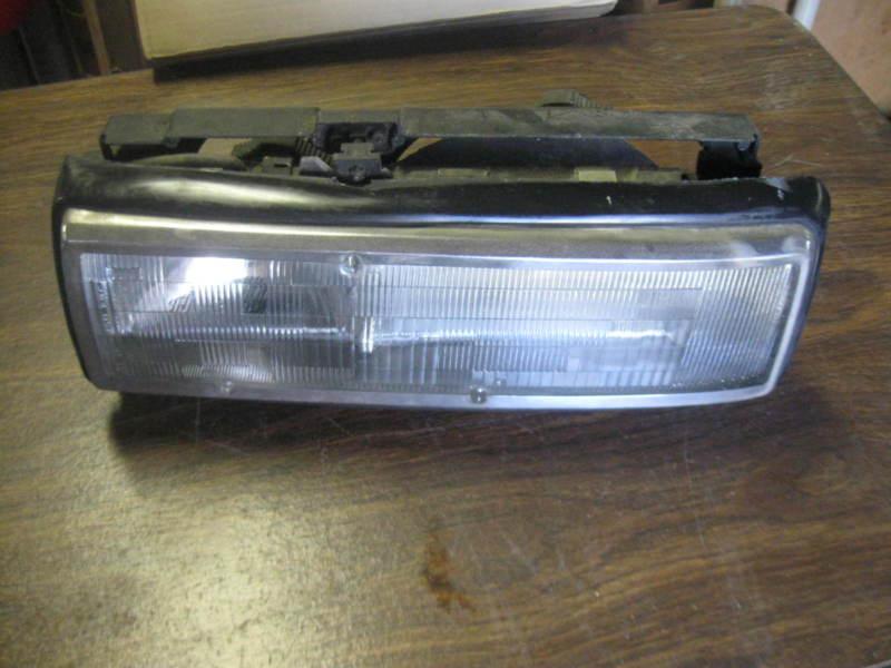 Oldsmobile calais head light driver left side 87-91 original part 16509447