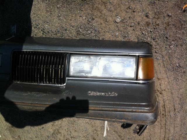 87 88 oldsmobile cutlass euro header panel with grille headlights