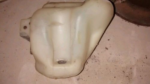 Fiero windhield washer fluid reservoir