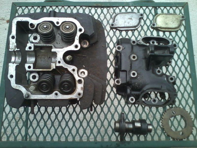 82 honda ft500 cylinder head with valves, cam, and rocker cover