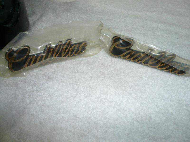   pair of cadillac grille emblem gold 