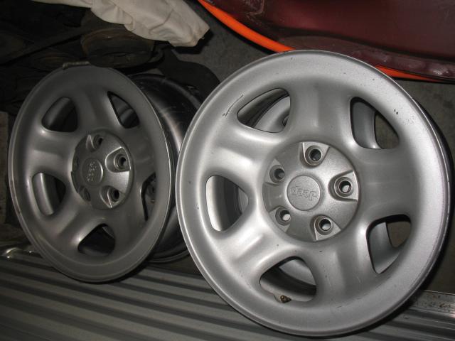 Set of 4 factory steel wheels with caps for 1990's jeep