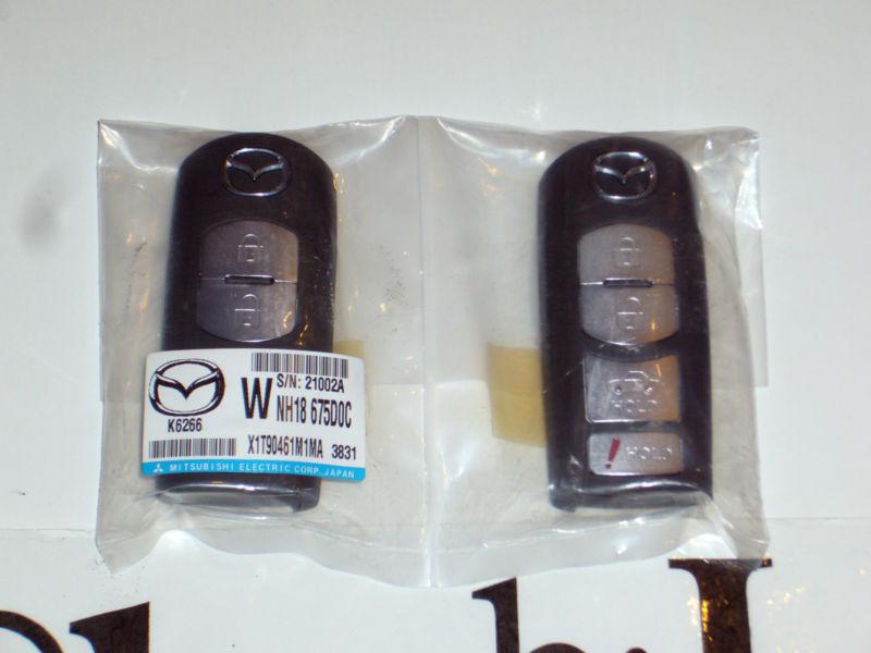 Factory sealed lot of 2 oem mazda smart keyless remote fob 4-button ske11a04