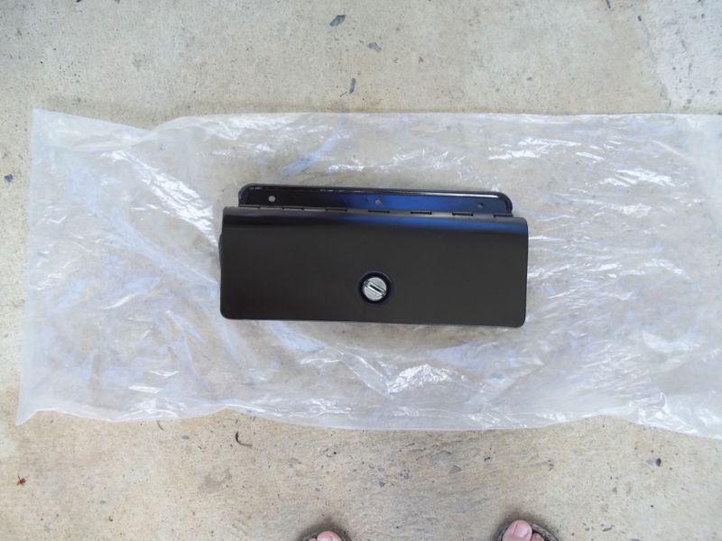 1975-79 chevy nova glovebox door in good condition with lock and labels