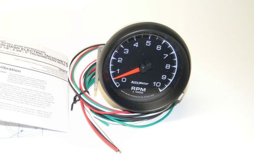 Autometer es series tach 0-10,000 3 3/8&#034; in-dash black face p/n 5997 exc cond