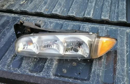 1996 - 1999 pontiac bonneville original driver left side headlight - oem