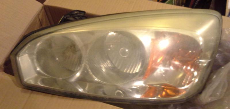 '04-'07 chevy malibu headlight assembly / drivers side / pn 21998709