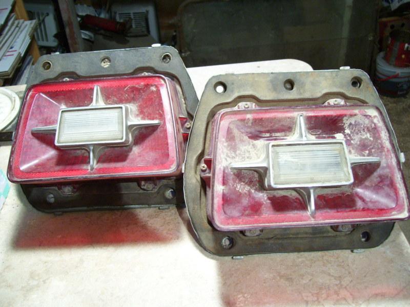 Pair of vintage oem 1969 ford car tail light housings assemblies