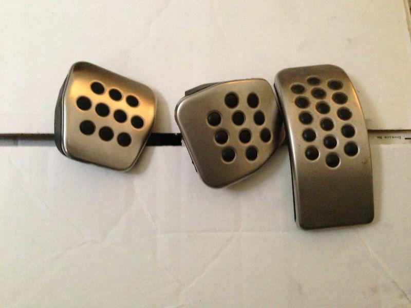 Set of used brushed pedal covers for manual transmission from a vw mk4 gli jetta