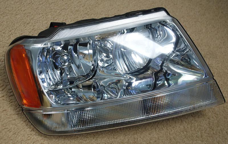 Oem jeep grand cherokee limited headlight headlamp 2003 with bulbs and harness