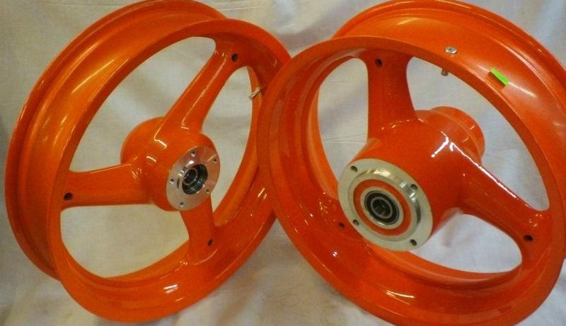 New buell front & rear  wheel, blazing orange, g0309.gayau, g0110.gayau