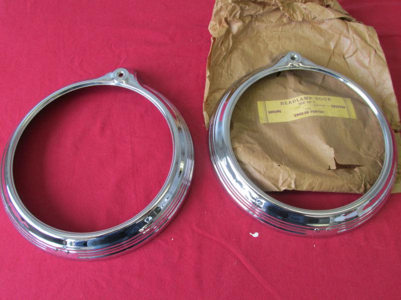 1942-48 pontiac chrome headlamp headlight doors bezels new nice pair 1013