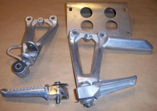 Assorted motorcycle peg pieces and license plate bracket / holder  