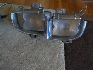 1960 cadillac left side set of 2 driving/blinker lamp assemblies,w/bezels!!!