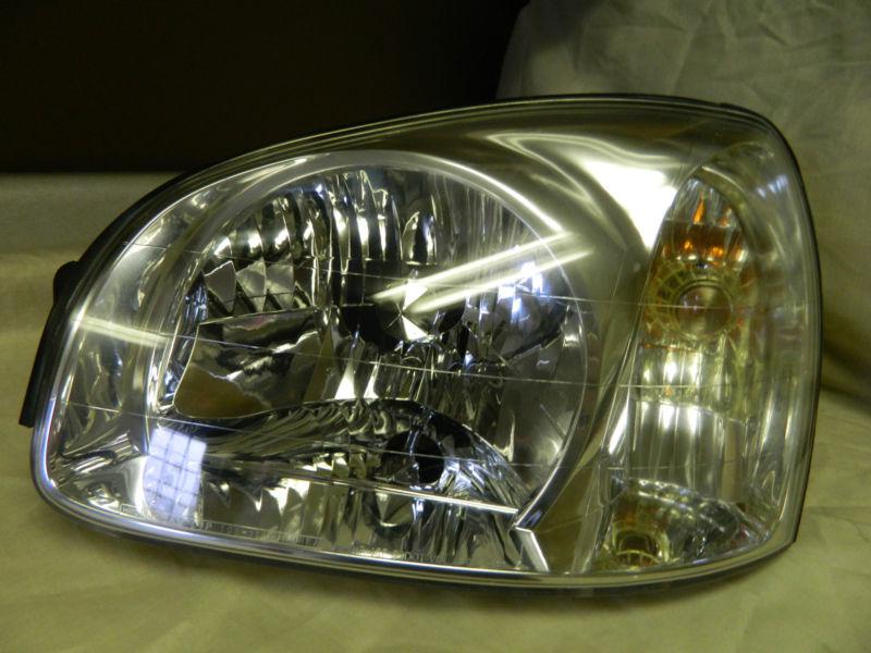 Oem 2001-2003 hyundai santa fe left/ driver side halogen headlight