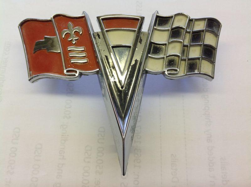 Original 1963 corvette nose emblem with all mounting studs.