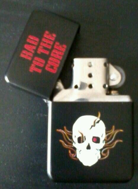 New metal flip top lighter - bad to the core.  lighter only, no tin case.