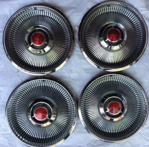 Set of 4 original chrysler new yorker hubcaps.