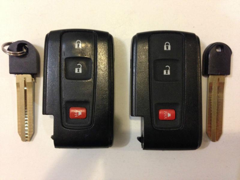 Toyota prius lot of 2 smart key less with uncut insert blade 04-09 silver logo