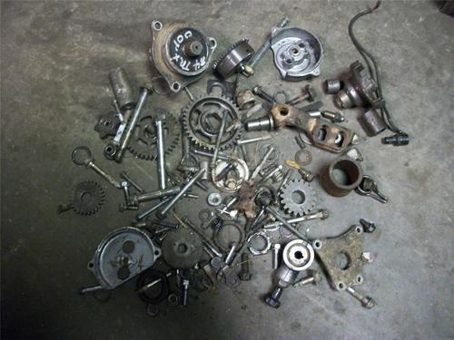 84 honda trx 200 a box of engine parts & bolts