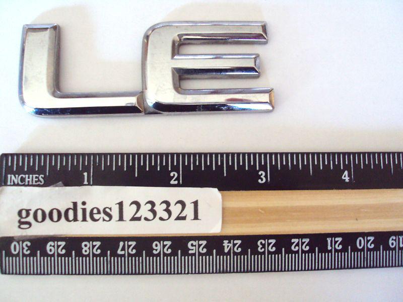 Nissan le chrome emblem 3" x 1 1/4"