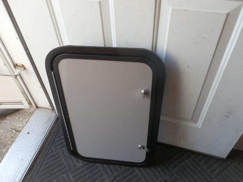 Rv cargo door r.o. 23" x 15" x 2"  grey/black ( used )