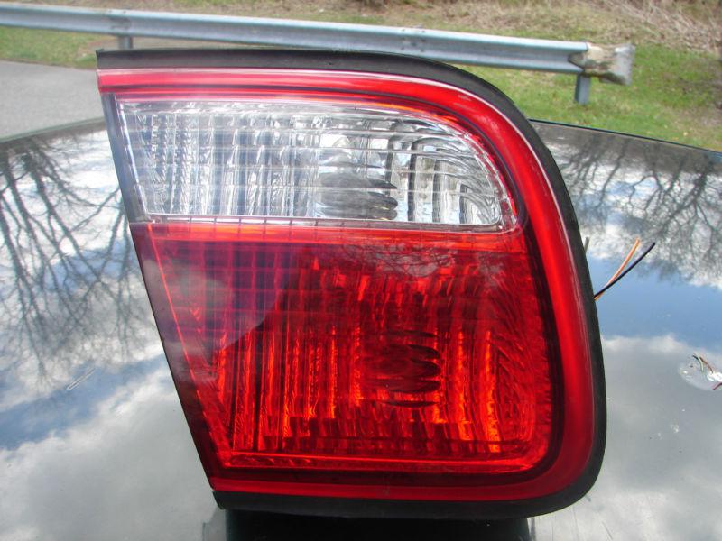 1999 00 millenia tail light inner trunk lid mounted lh