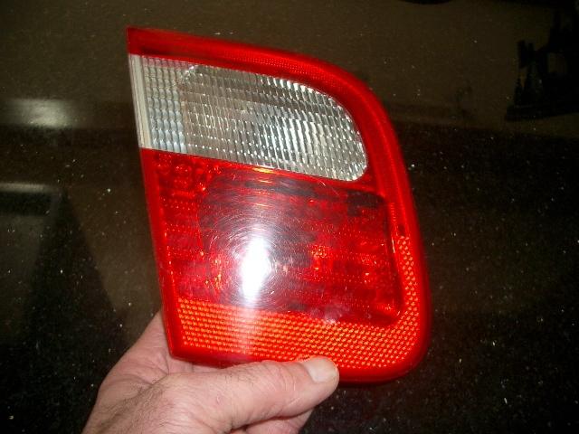 Genuine bmw 2001 bmw 3 series left/drivers tail light trunk lid