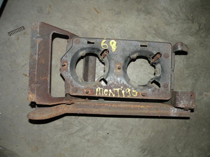 1969 montego headlight backing plate assembly  oem