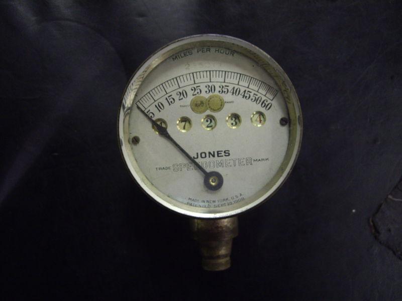 Silver face 60 mph jones speedometer in original condition, not restored.