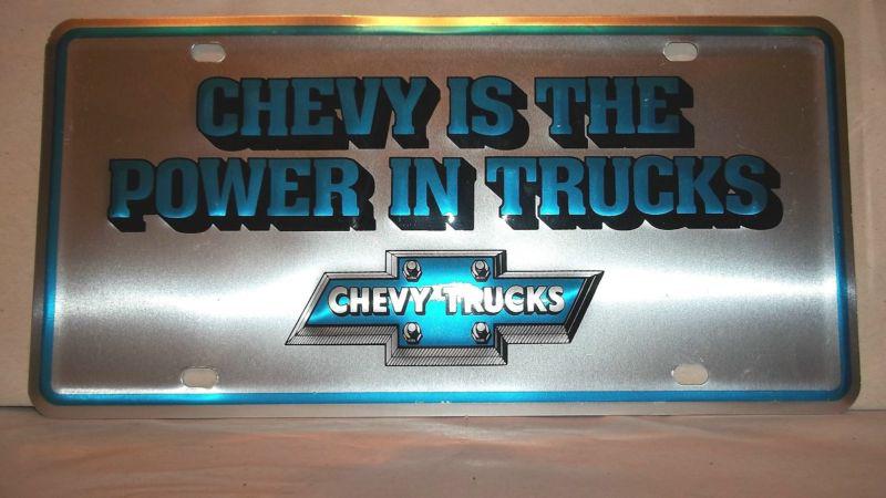 "chevy is the power in trucks" dealer license tag plate unused