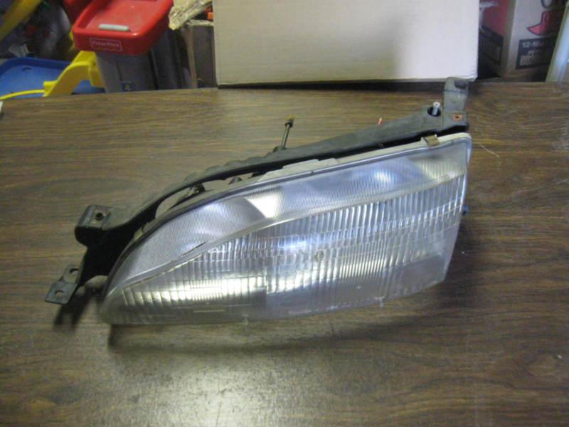 Toyota camry head light left driver lh  92-96 factory original part