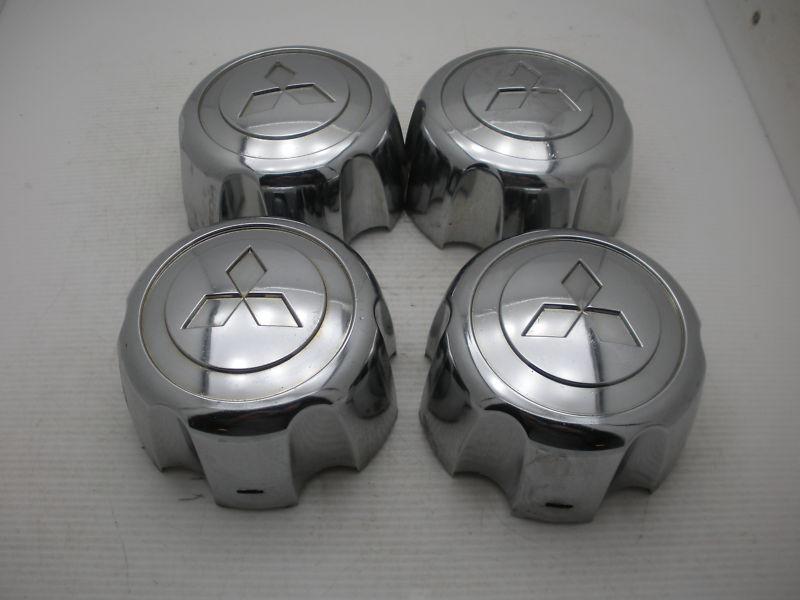 Lot of 4 oem 00 01 02 03 04 mitsubishi montero  wheel center caps hubcaps