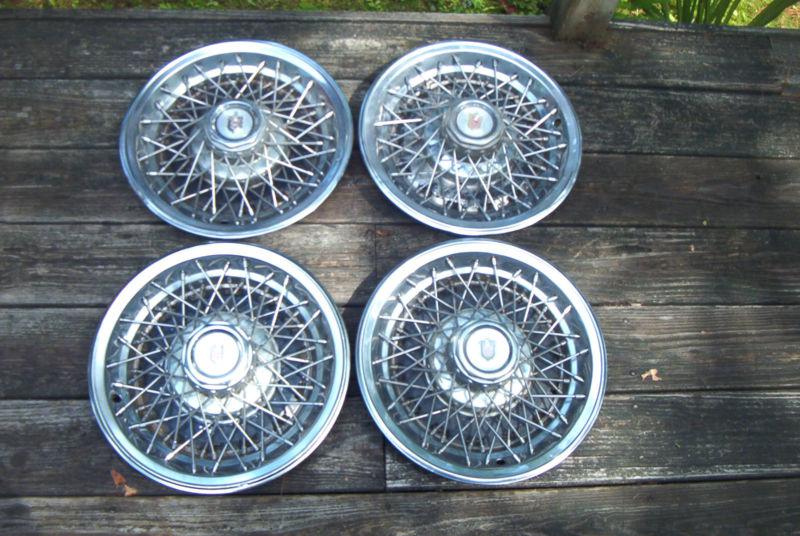 Oe set of 4 1978-79 monte carlo 14 inch wire wheelcovers, good driver quality