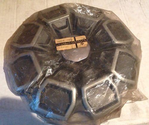 New. old stock. nissan/datsun hub cap. part number 40315-m5602.