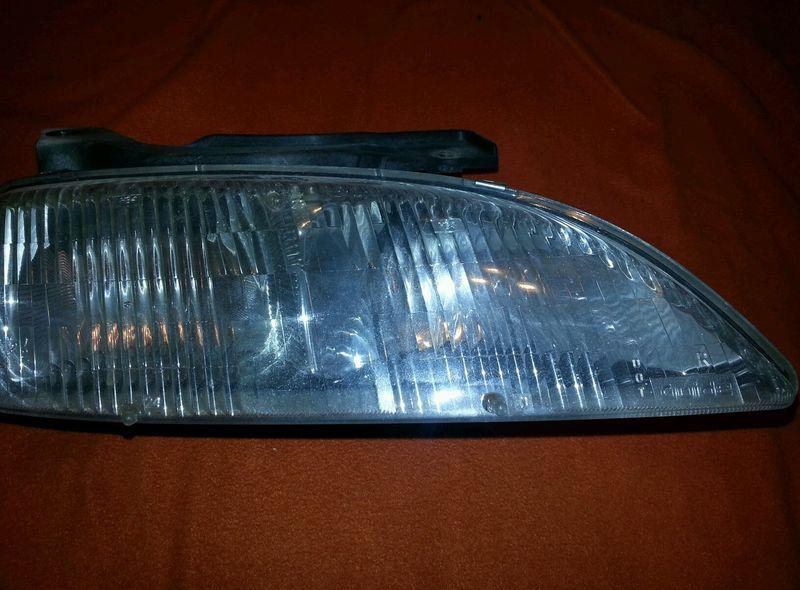 Right/passenger side  95 96 97 98 99 chevy cavalier composite headlight