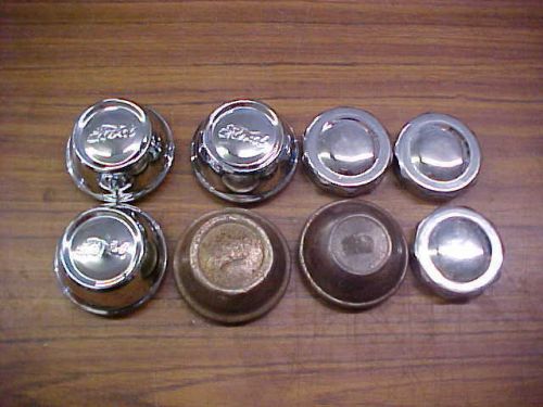 8 vintage ford hub caps