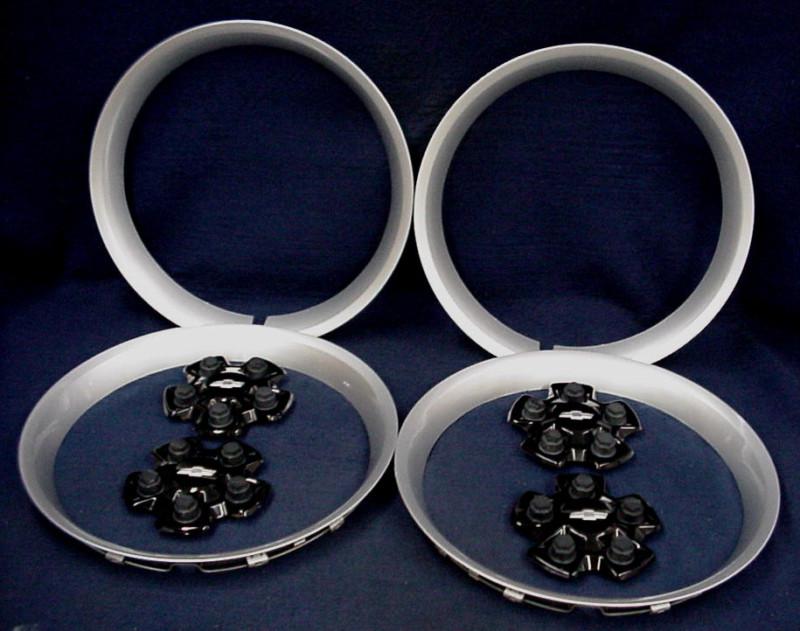 Chevy camaro 10-13 black center caps and 18" silver trim rings - set of 4 - oem